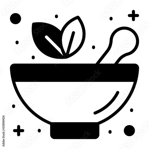 Mortar pestle with herbal leaves denoting herbal medicine