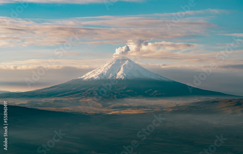 aerial view of the cotopaxi volcano in the early morning hours, with a very foggy environment, you can see a large part of the countryside which is a natural reserve.