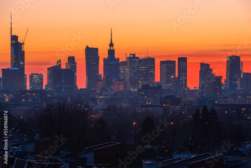 Panorama Warszawy o zachodzie słońca. Biurowce, wieżowce i pałac kultury widziany z góry photo