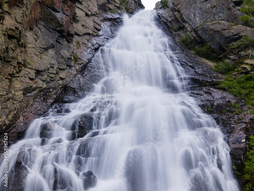 natural waterfall from the rocks in the mountain forest