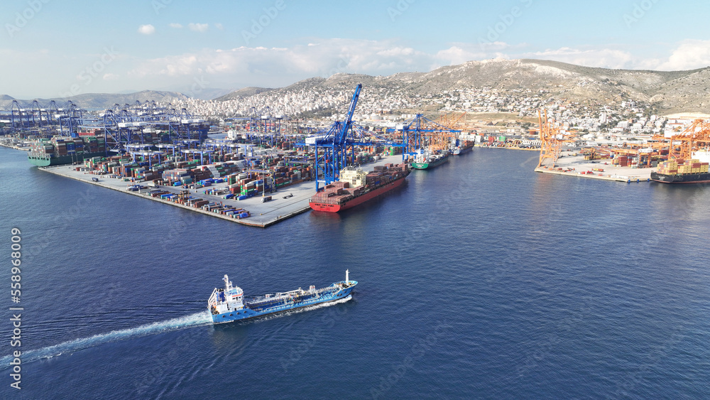Aerial drone panoramic photo of industrial container logistics unloading import and export container terminal of Perama - Piraeus, Greece