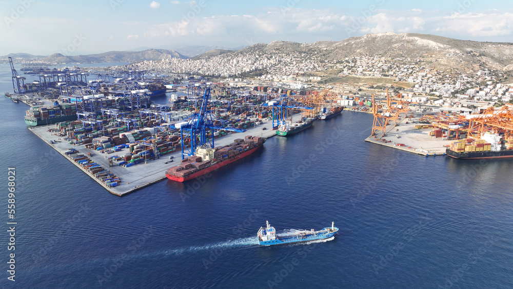 Aerial drone panoramic photo of industrial container logistics unloading import and export container terminal of Perama - Piraeus, Greece