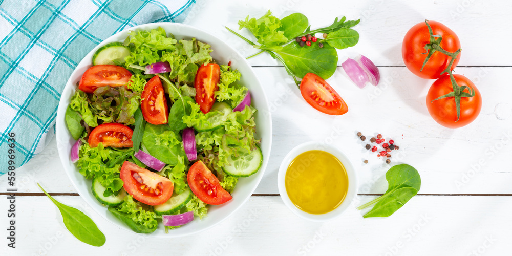Mixed salad with fresh tomatoes healthy eating food from above banner on a wooden board Mixed salad with fresh tomatoes healthy eating food from above banner on a wooden board