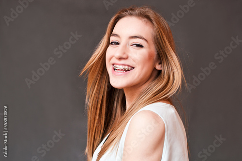 girl wearing braces with a joyful smile