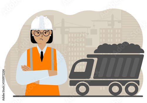 Civil engineer in a vest and hard hat at a construction site. Workers and dump truck with sand. Development, design for the site.