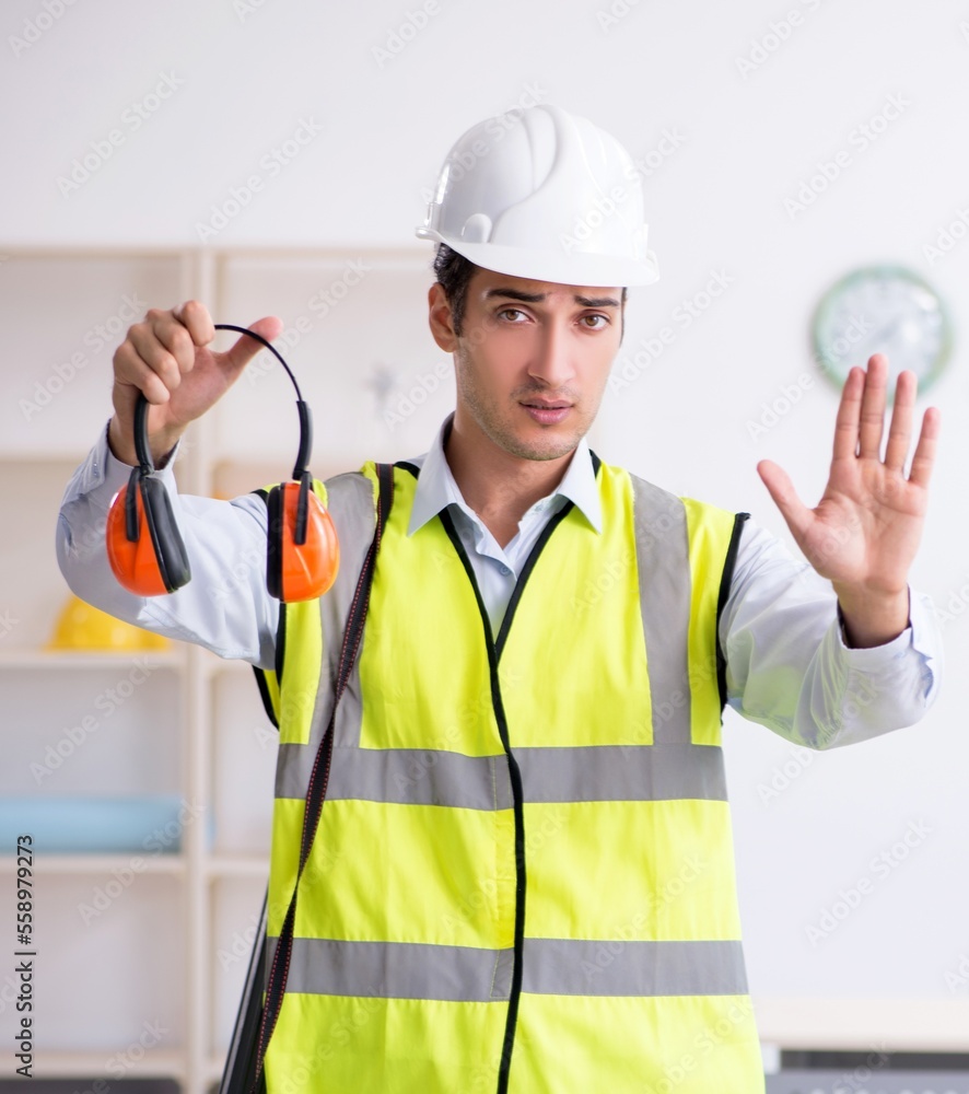 Young male architect working in the office Young male architect working in the office