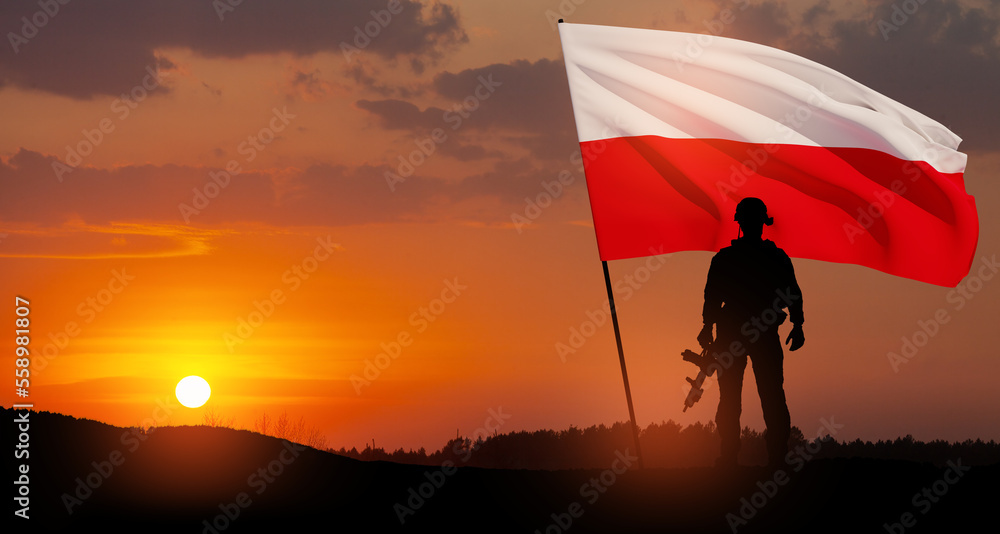 Silhouette of soldier with national flag on background of sunset. Polish Armed Forces. Armed Forces of the Republic of Poland. Polish army.