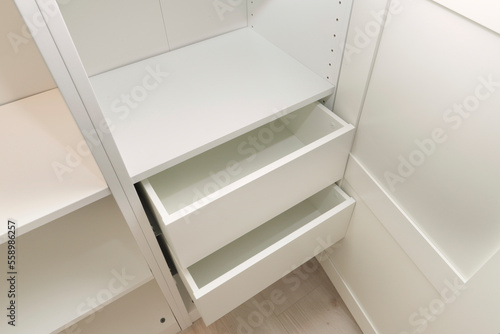 empty drawers and metal accessory for white cabinet interiors