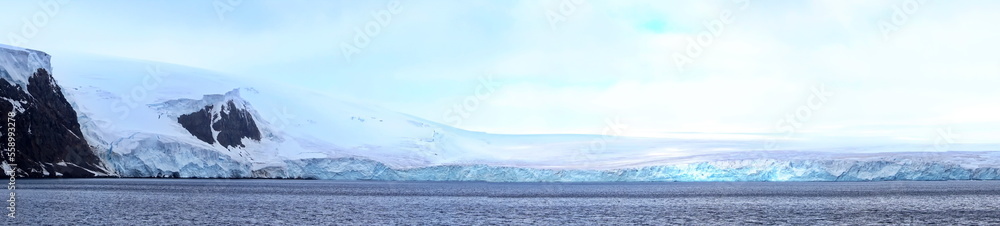 Panorama of a glacier meeting the Southern Ocean at Kinnes Cove, Joinville Island, Antarctica