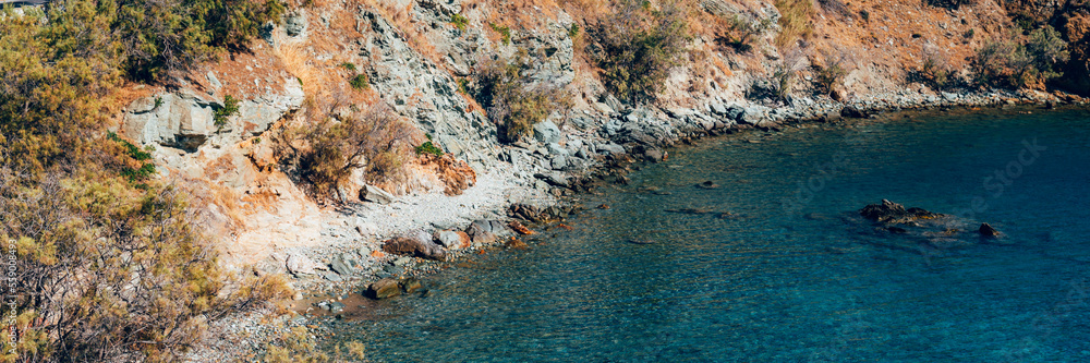 Obraz premium Kionia Beach swimming, the place to embrace the Aegean Sea, Tinos, Greece, banner size