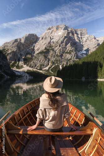 woman on the boat on the mountain lake
