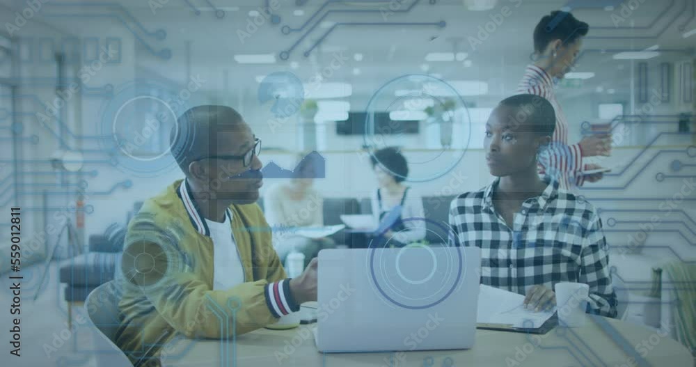 Animation of data processing over african american male and female colleagues discussing at office Animation of data processing over african american male and female colleagues discussing at office