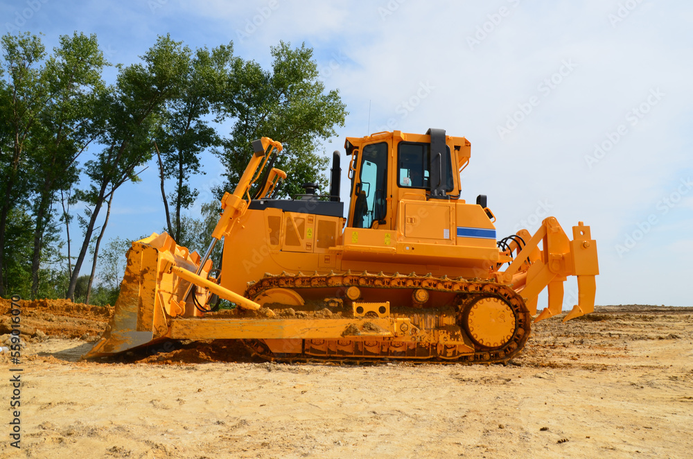 Big crawler dozer working on construction site or quarry. Mining machinery moving clay, smoothing gravel surface for new road. Earthmoving, excavations, digging on soils Big crawler dozer working on construction site or quarry. Mining machinery moving clay, smoothing gravel surface for new road. Earthmoving, excavations, digging on soils