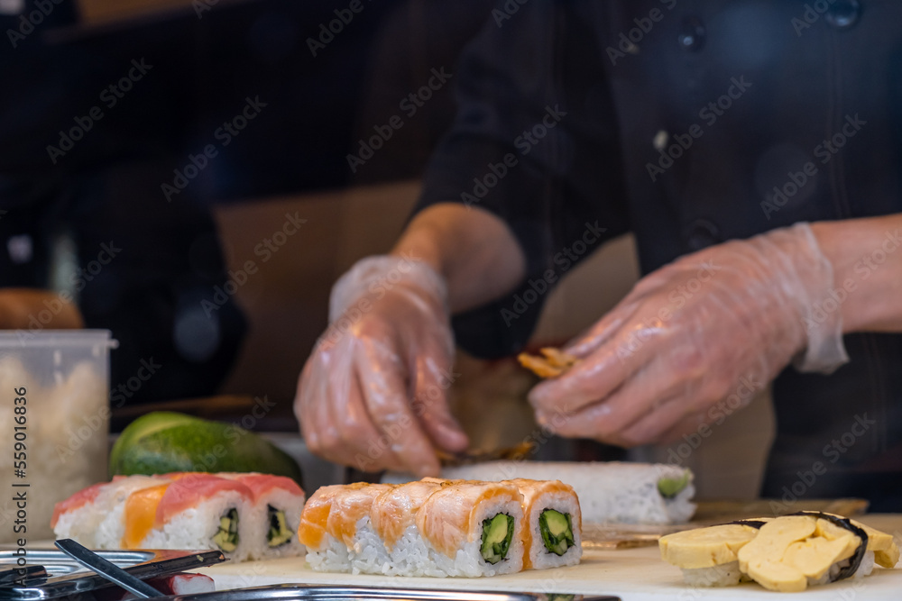 Chef preparing sushi in a restaurant