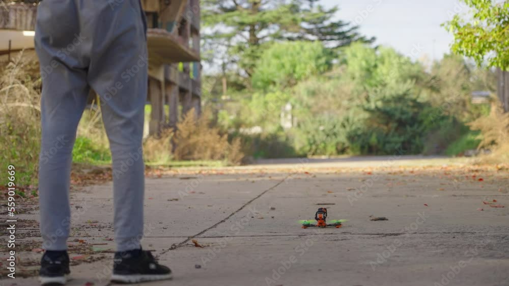 Pilot taking off FPV drone Pilot taking off FPV drone