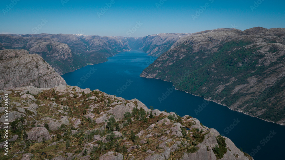 View into the Lysefjord fjord at Preikestolen, during blue sky day with sun