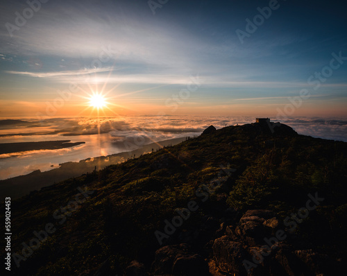 Sunrise over a misty Flagstaff Lake from summit of Bigelow Mountain. photo