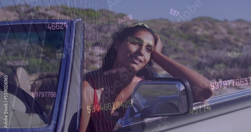 Animation of data processing over biracial woman driving car photo