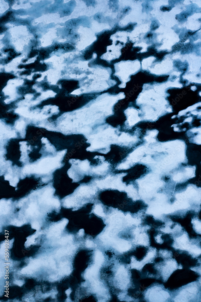 Melting ice in a lake of Hardangervidda in Norway from above Melting ice in a lake of Hardangervidda in Norway from above