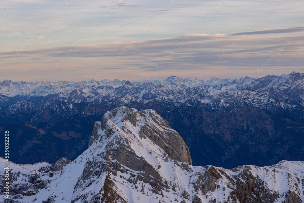 Epic mountain peaks over the Swiss Alps in Appenzellerland viewed from Säntis.