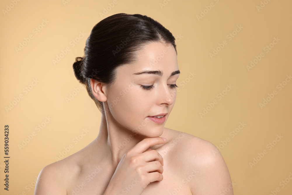 Portrait of attractive young woman on beige background. Spa treatment Portrait of attractive young woman on beige background. Spa treatment