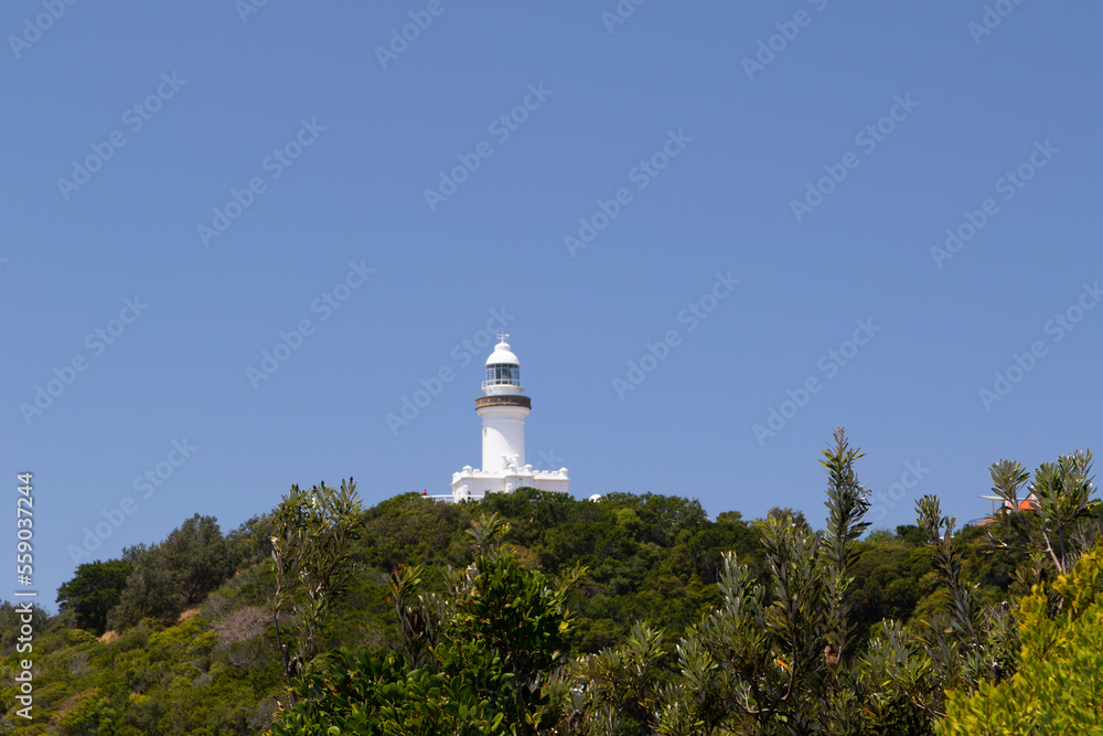 A white lighthouse on a hill A white lighthouse on a hill