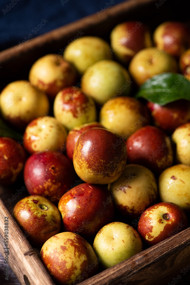 Chinese jujube or winter jujube on wooden table Chinese jujube or winter jujube on wooden table