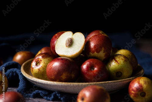 Картината върху платно Chinese jujube or winter jujube on wooden table