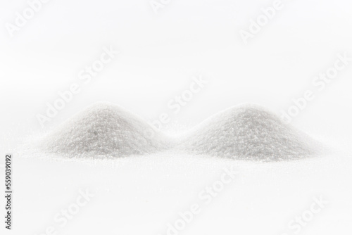 heaps of salt crystals on white background
