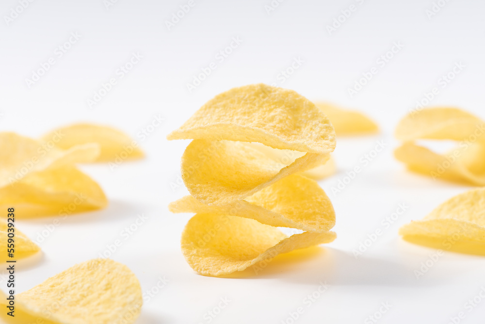 Pile of potato chips on white background. Pile of potato chips on white background.