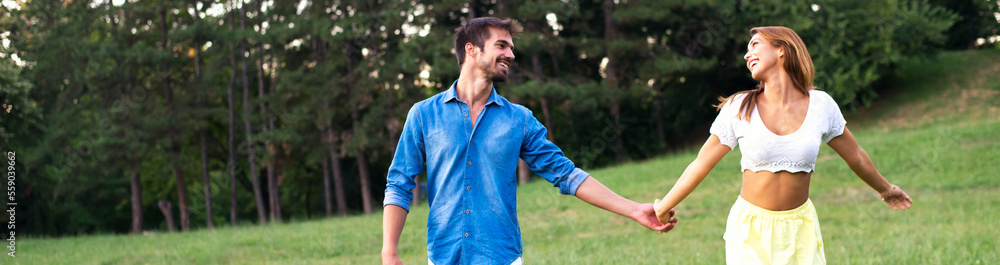 Young smiling couple walking in the summer nature Young smiling couple walking in the summer nature