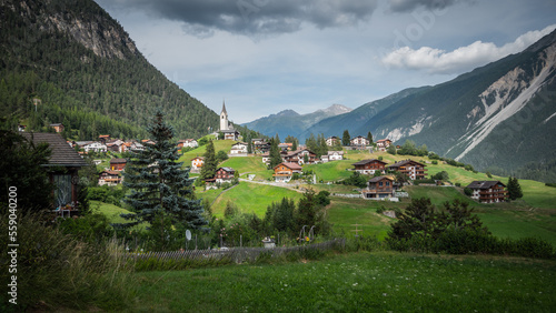 Typical Swiss village in a valley of the Swiss Alps in Switzerland - travel photography