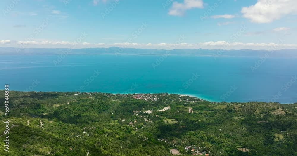 The coastline of the island of Cebu against the backdrop of the blue sea and the island of Negros. Philippines. The coastline of the island of Cebu against the backdrop of the blue sea and the island of Negros. Philippines.