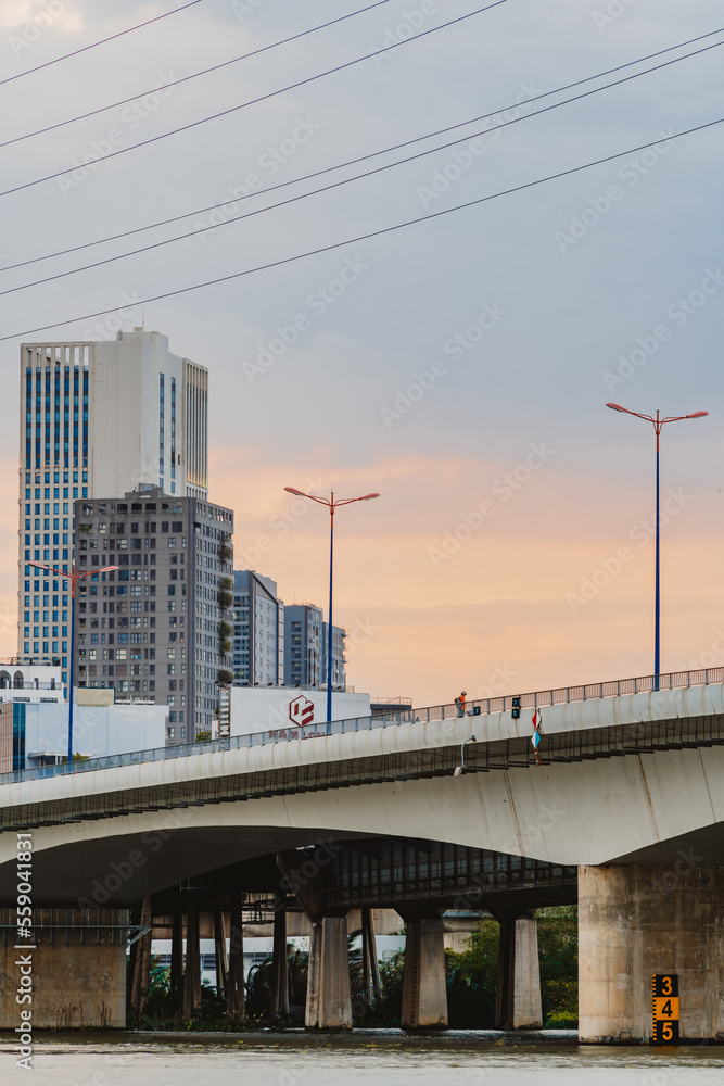 Beautiful Sunset at Landmarks 81 Ho Chi Minh City, the tallest building in Vietnam, with Vietnam flag on the top building. Travel concept