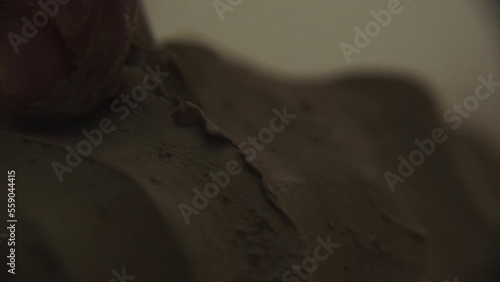 a potter makes a clay teapot in his workshop in a seashell video. a potter working with clay. a potter makes a unique clay teapot using authentic tools. women's, men's hands work with clay. 