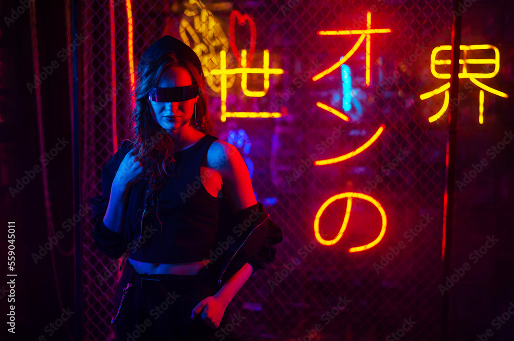 Caucasian woman in sunglasses posing in neon studio. Caucasian woman in sunglasses posing in neon studio.