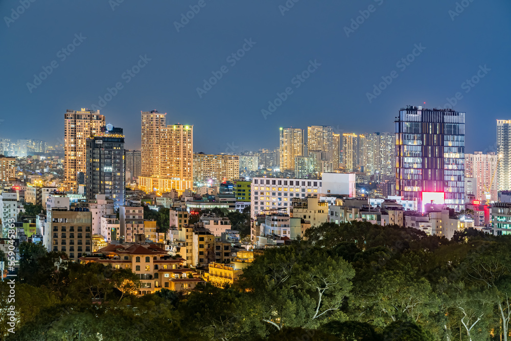 Fototapeta premium Ho chi minh at night view to city - there a alot of skyscraper, cityscape in the night, blue hour, see Bitexco tower. Travel concept
