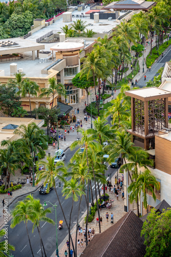 View looking down on Kalakaua Avenue in Waikiki during the evening. photo