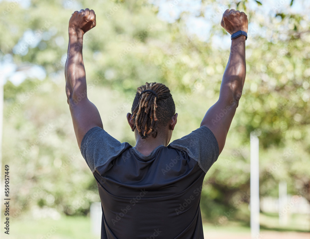Winner, fitness and black man running outdoor with success, exercise in park with training and active lifestyle. Runner back view, freedom with workout and sports motivation, celebration, win and run
