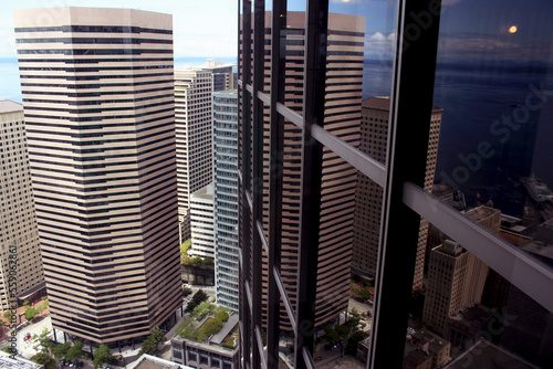 Reflection of the city in a mirror building at a great height