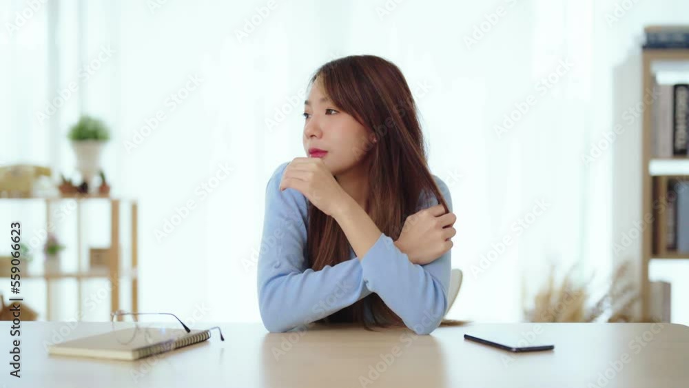 Distracted from work worried young asian woman thinking of problems. Pensive unmotivated lady looking at window, feeling lack of energy Distracted from work worried young asian woman thinking of problems. Pensive unmotivated lady looking at window, feeling lack of energy