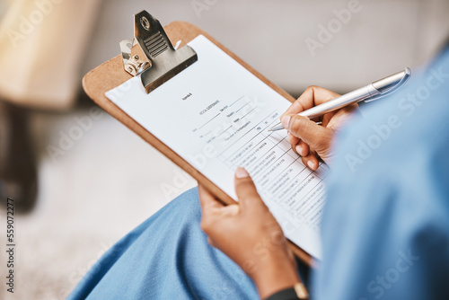 Nurse, clipboard and writing checklist for patient, healthcare consulting and medical information. Closeup doctor hands write documents, data and questions on wellness report, planning or paper admin
