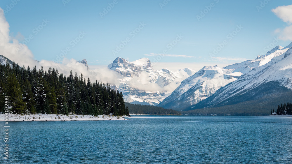 Maligne Lake in Jasper National Park, Snow-capped mountains towering above the lake. Canadian Rockies. Canada.
