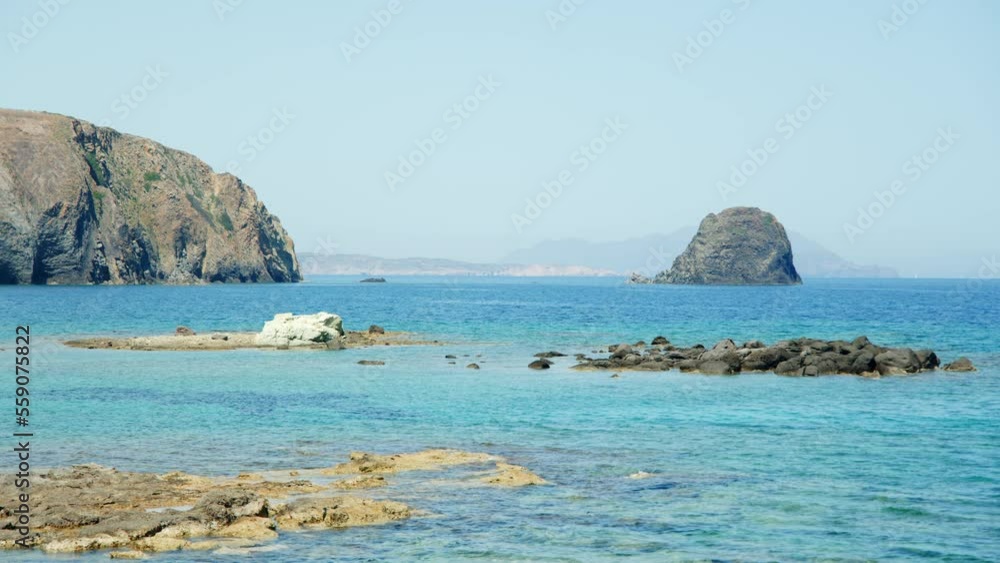 Volcanic rocks into the sea, Milos Island, Greece Volcanic rocks into the sea, Milos Island, Greece