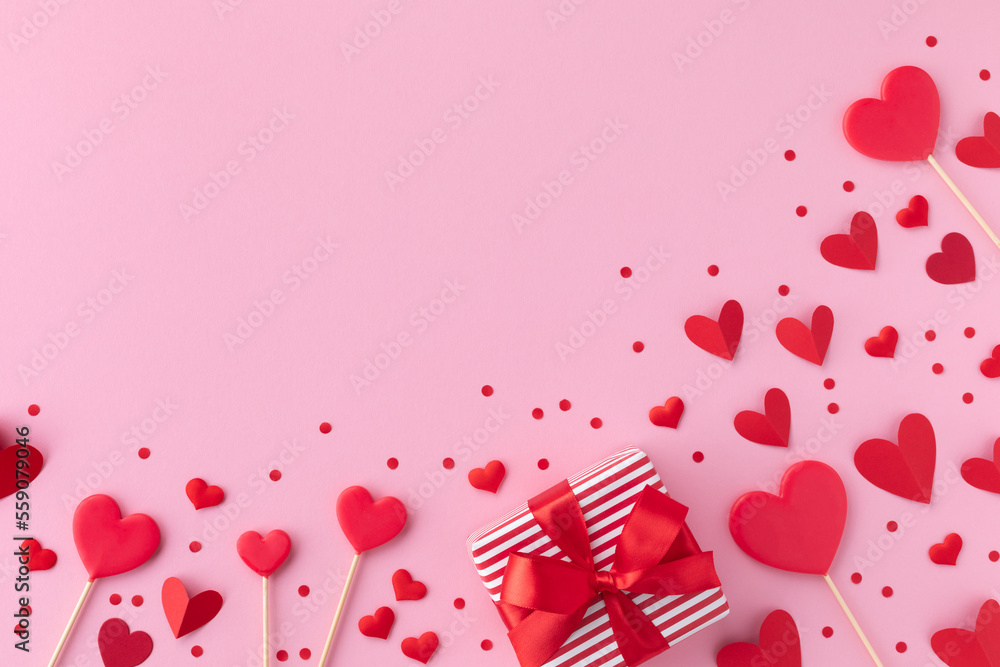 Saint Valentine day background with gift box and various red hearts. Flat lay style greeting composition. - obrazy, fototapety, plakaty 