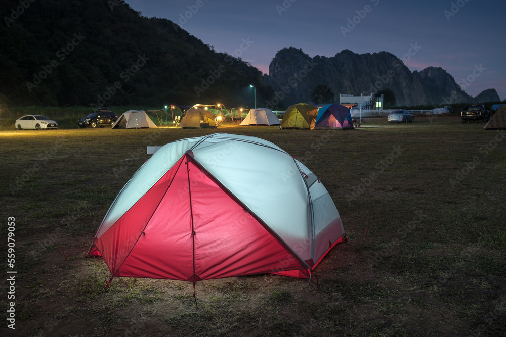 Tourist tent at night. evening sky