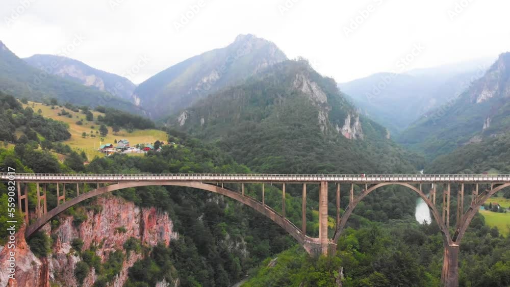 Aerial of Djurdjevica Bridge over Tara river canyon in Montenegro. Grerat tourist attraction and unique architectural structure Aerial of Djurdjevica Bridge over Tara river canyon in Montenegro. Grerat tourist attraction and unique architectural structure