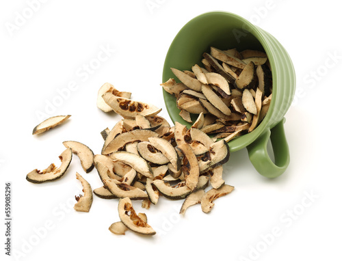 Dried bitter orange used in chinese herbal medicine isolated over white background. Zhi Ke, Fructus citri Aurantii. White background photo