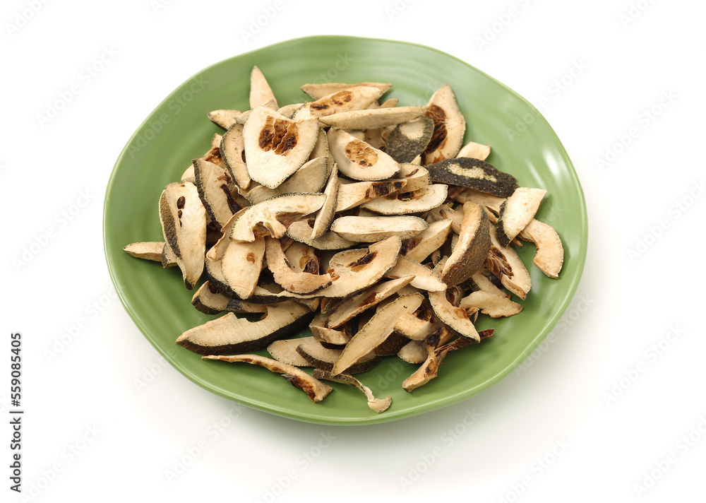 Dried bitter orange used in chinese herbal medicine isolated over white background. Zhi Ke, Fructus citri Aurantii. White background Dried bitter orange used in chinese herbal medicine isolated over white background. Zhi Ke, Fructus citri Aurantii. White background