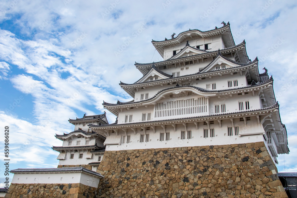 The view of Himeji Castle in autumn, a hilltop Japanese castle complex. It is located in the Hyogo Prefecture of Japan,  one of the first UNESCO World Heritage Sites.
